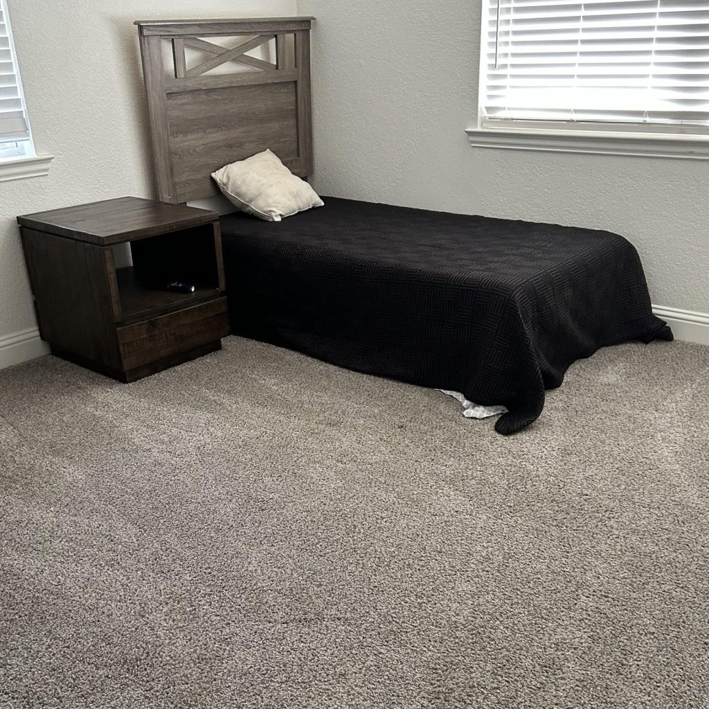 Tidy bedroom with freshly vacuumed carpet